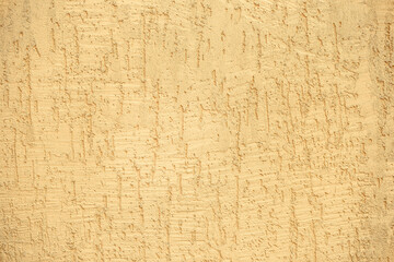 yellow decorative concrete wall, plaster light background, building wall