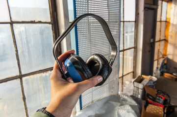 Man holding blue helmet close up