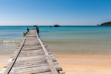 Fototapeta na wymiar old wooden pier, lazy beach, koh rong samloem island, Sihanoukville, Cambodia.