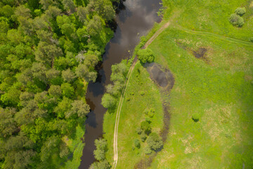 High angle flying above river in deep forest, Moscow area, Russia