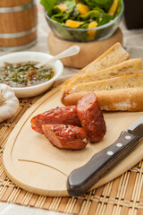 sausages and vegetables, classic Argentinian choripan.