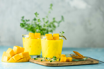 Yellow Indian mango yogurt drink Mango Lassi or smoothie with turmeric and saffron. Healthy...