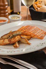 grilled salmon steak with potatoes.