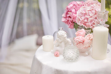 picnic in the forest with sweets, flowers hydrangea and candles