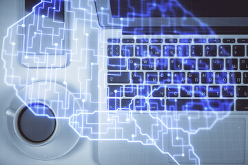 Double exposure of brain drawing hologram over topview work table background with computer. Concept of big data.