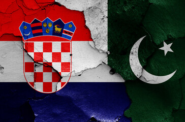 flags of Croatia and Pakistan painted on cracked wall