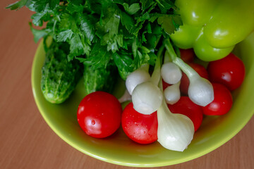 Washed, fresh salad ingredients - variety of healthy vegetables for a raw meal