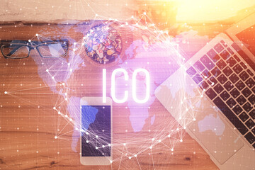 Double exposure of blockchain theme hologram over table with phone. Top view. Crypto technology concept.