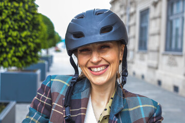 young woman with bicycle protective helmet