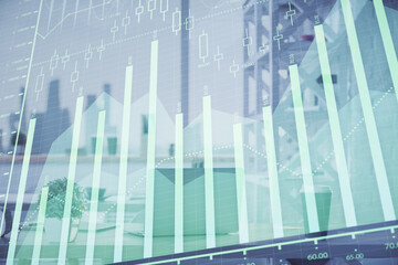 Double exposure of stock market graph drawing and office interior background. Concept of financial analysis.