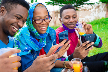 young black people, drinking juice, using their phones, post coronavirus social concept
