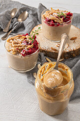 Breakfast oatmeal porridge with raspberries, almond, cinnamon, almond butter and coconut. Healthy breakfast delicious homemade english breakfast concept