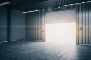 Modern warehouse interior with concrete flooring and rolling gates