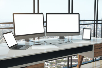 Contemporary workplace with two empty white monitors