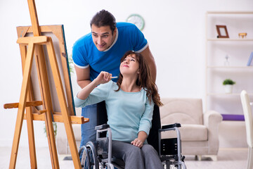 Fototapeta na wymiar Disabled wife and young husband at home
