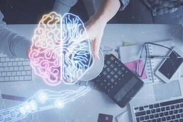 Double exposure of man and woman working together and human brain hologram drawing. Brainstorm concept. Computer background. Top View.