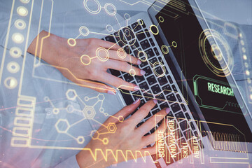 Double exposure of woman hands working on computer and data theme hologram drawing. Top View....