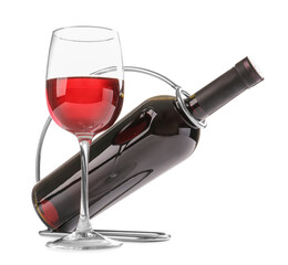 Holder with bottle and glass of wine on white background