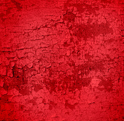 Cracked and peeling red oxidized paint on wood with texture and grunge finish
