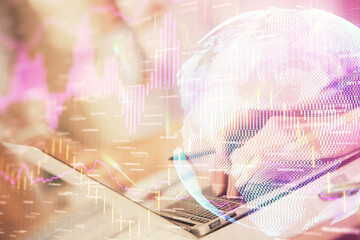 Double exposure of woman hands typing on computer and forex chart hologram drawing. Stock market invest concept.