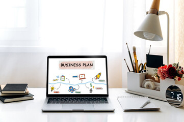 Business plan for a new business. Development of a concept of a step-by-step business plan for creating a new business, on a screen of a laptop