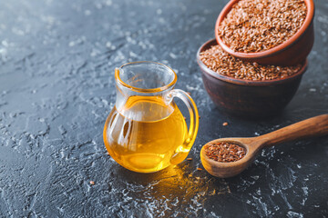 Composition with flax oil on dark table