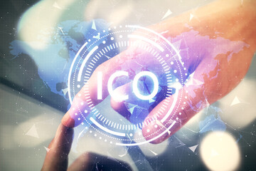 Double exposure of man's hands holding and using a phone and crypto currency blockchain theme...