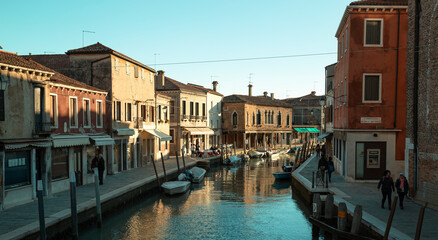 Fototapeta na wymiar Venice canal, walking across a bridge