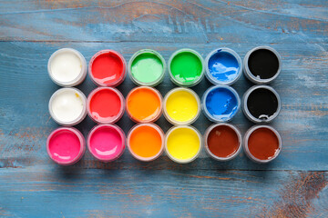 Bottles of gouache paints on table