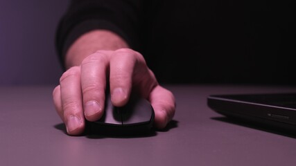 Cropped image of a young man working on his laptop in a coffee shop, rear view of business man hands busy using laptop at office desk.