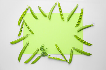 Frame made of tasty fresh peas on color background