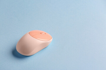 Modern computer mouse on color background
