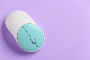 Modern computer mouse on color background