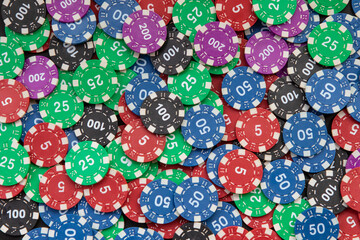 Background texture of casino game chips, like poker, blackjack, roulette to bet and win money in las vegas. All in black. Poker and blackjack championship champion.