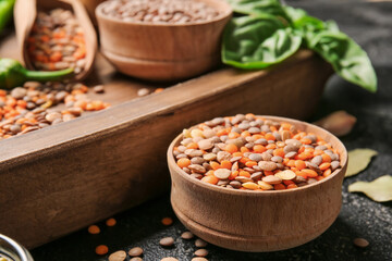 Bowl with lentils on dark background