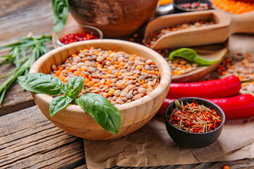 Bowl with lentils and spices on table
