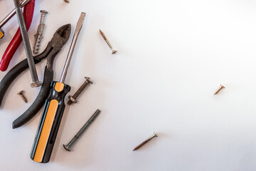 Top view of screwdrivers with screws for home DIY repairs