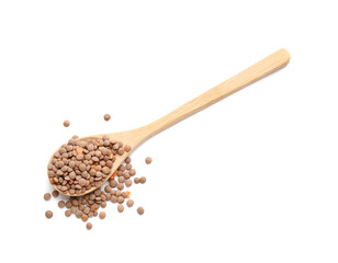Spoon with lentils on white background