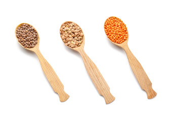 Spoons with lentils on white background