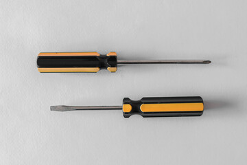 Fototapeta premium Top view of screwdrivers isolated with white background