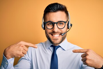 Young business operator man wearing customer service headset from call center looking confident...