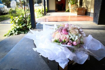Floral wedding bouquet in natural garden setting