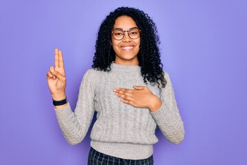 Young african american woman wearing casual sweater and glasses over purple background smiling swearing with hand on chest and fingers up, making a loyalty promise oath