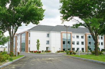 exterior view of modern rental apartment buildings and road