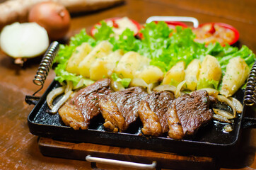 porção de picanha com mandioca