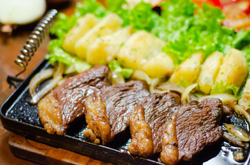 porção de picanha com mandioca