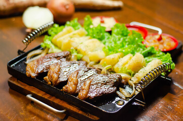 porção de picanha com mandioca