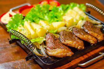 porção de picanha com mandioca