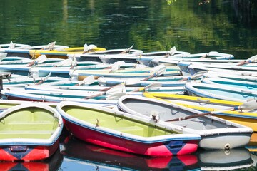 Fototapeta na wymiar Colourful wooden boats on a lake