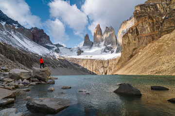 Hiker at Mirador Las Torres in Torres del Paine National Park, Chilean Patagonia, South America. - obrazy, fototapety, plakaty